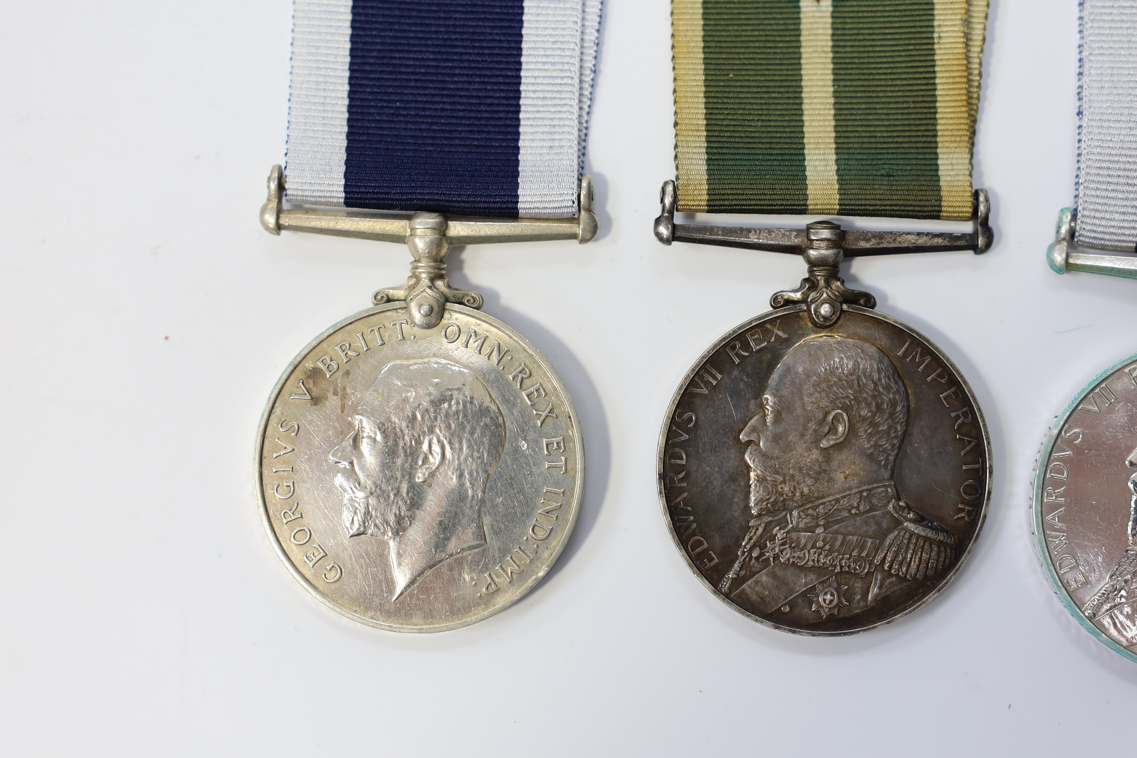 Three LSGC medals; Ed VII Royal Naval LSGC to 158678 J.A.Ford, Boat'n, H.M.Coast.Guard; Geo V Royal Naval LSGC to M.39756L.Parvin.R.P.O. H.M.S.Dunedin; Ed VII Royal Naval Reserve LSGC to D.3299 W.H.Pender, Sea'n 1.CL, R.